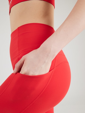 Skinny Pantalon de sport 'OASIS' Fabletics en rouge