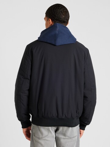 Champion Authentic Athletic Apparel Between-Season Jacket 'Legacy' in Black