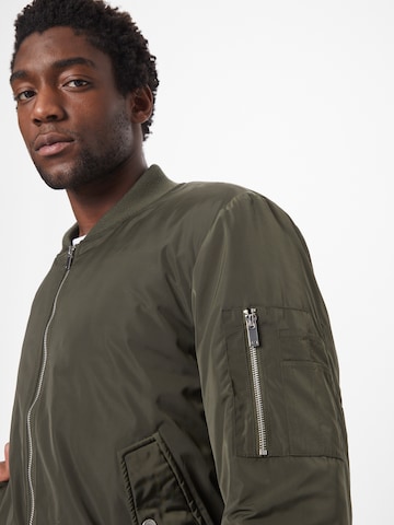 ABOUT YOU Between-season jacket 'Colin' in Green