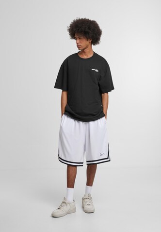 Karl Kani Loose fit Pants 'Signature' in Mixed colors