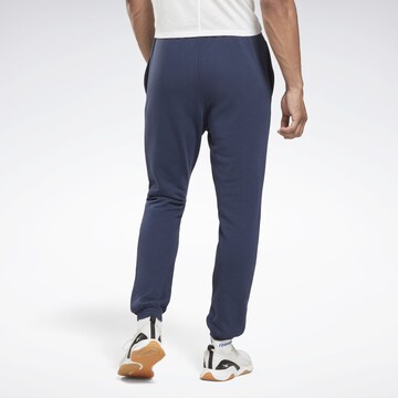 Tapered Pantaloni sportivi di Reebok in blu