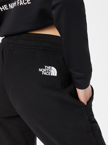 Effilé Pantalon de sport THE NORTH FACE en noir