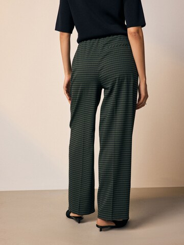 Wide leg Pantaloni con piega frontale di Next in verde