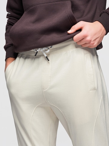 Effilé Pantalon de sport Ombre en beige