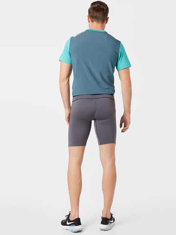 NIKE Skinny Sporthose in Grau