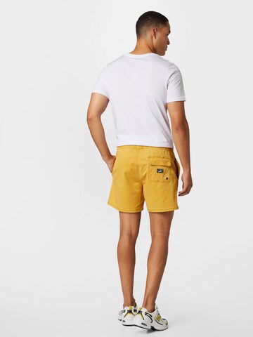 Superdry Normální Kalhoty – žlutá