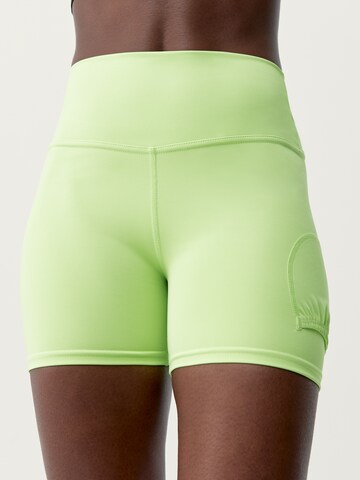 Born Living Yoga Skinny Workout Pants 'Volea' in Green: front
