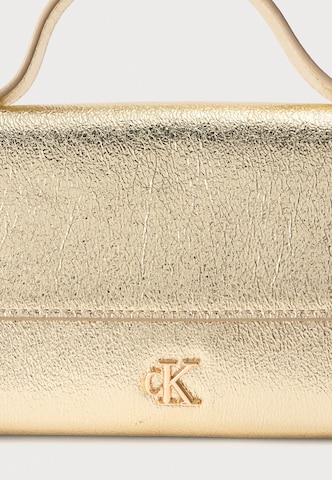 Calvin Klein Τσάντα ώμου σε χρυσό: μπροστά