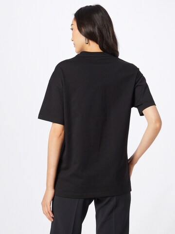 9N1M SENSE - Camiseta 'EYE TO EYE' en negro