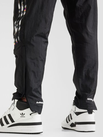 regular Pantaloni sportivi 'Pride Tiro' di ADIDAS SPORTSWEAR in nero