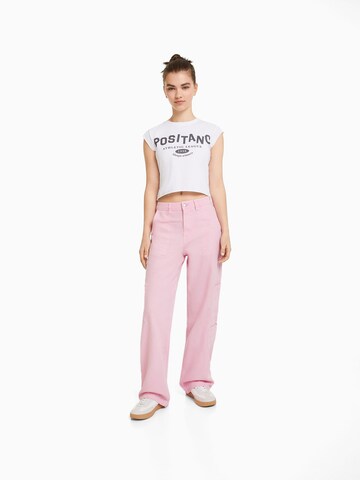 Bershka Loose fit Cargo trousers in Pink