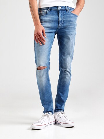 Tommy Jeans Kitsas Teksapüksid 'SIMON', värv sinine: eest vaates
