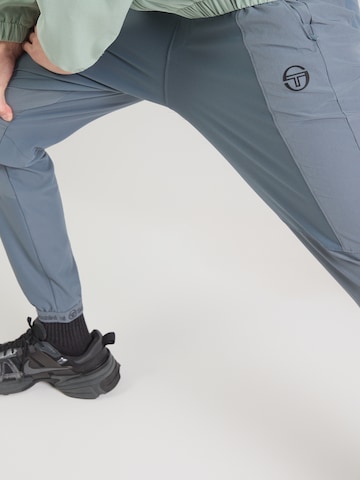 Sergio Tacchini Tapered Urheiluhousut 'Pelle' värissä harmaa