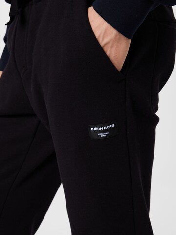 Tapered Pantaloni sportivi 'CENTRE' di BJÖRN BORG in nero