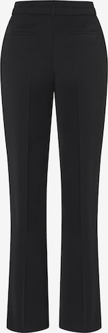 MORE & MORE - Acampanado Pantalón de pinzas en negro