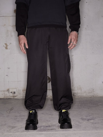 ABOUT YOU x Rewinside Regular Pants 'James' in Black: front