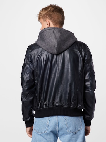 ALPHA INDUSTRIES Välikausitakki värissä musta