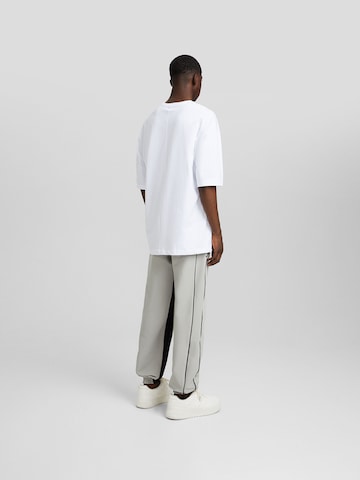 Bershka Tapered Nadrág - szürke