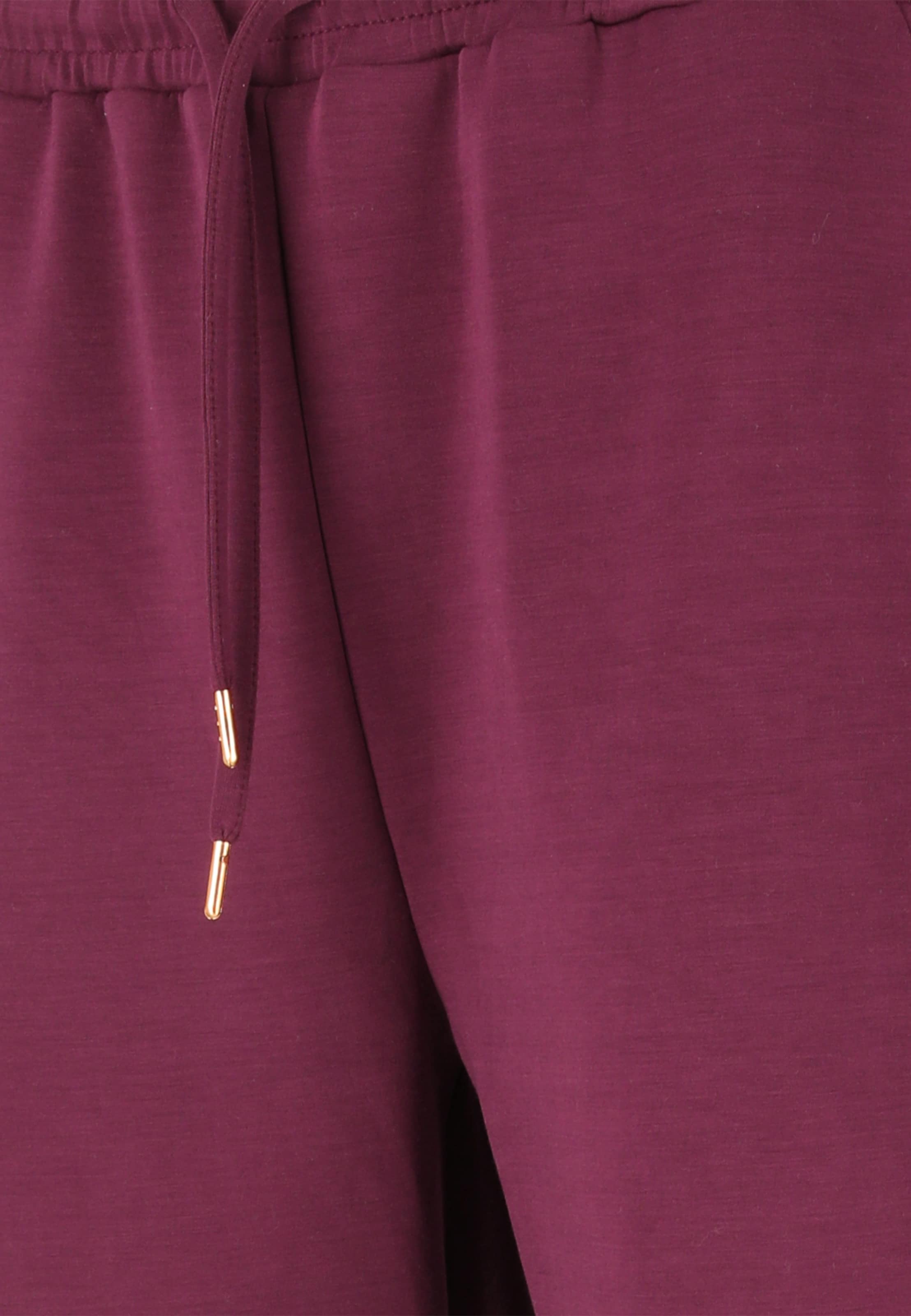 Athlecia Tapered Sports trousers 'Jacey' in Red