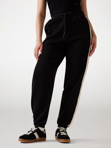 GUESS Tapered Pants in Black: front