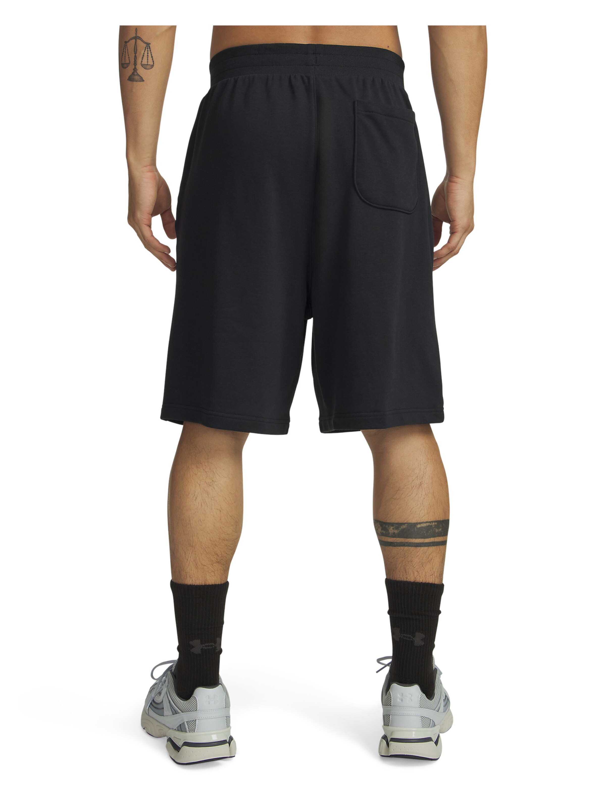 UNDER ARMOUR Wide leg Sportbroek 'Rival' in Zwart