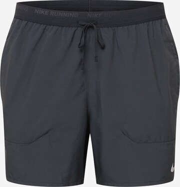 NIKE Regular Workout Pants 'Flex Stride' in Black: front