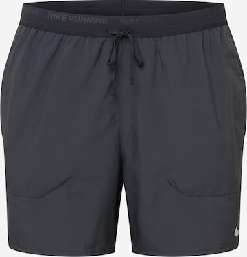 NIKE - Regular Calças de desporto 'Flex Stride' em preto: frente