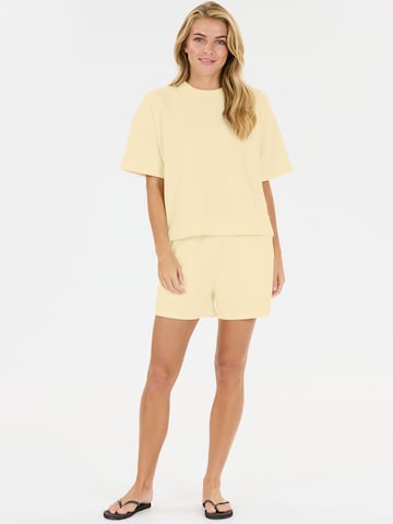 Athlecia - regular Pantalón deportivo 'Crecy' en amarillo
