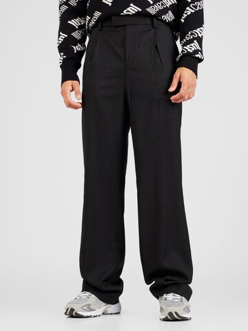 TOPMAN Loose fit Pleat-front trousers in Black: front