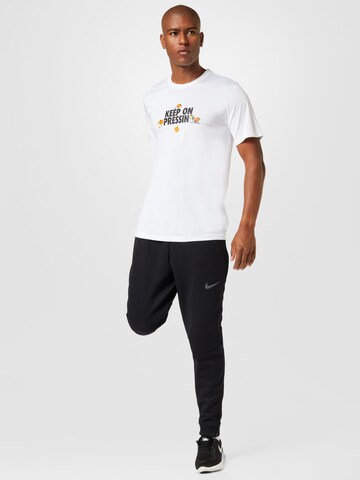 T-Shirt fonctionnel NIKE en blanc