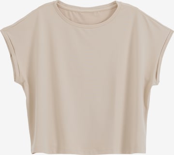 Maglia funzionale di Aim'n in beige: frontale