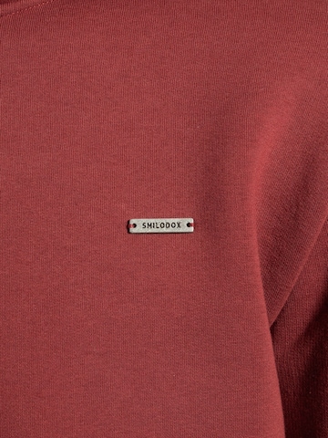 Veste de survêtement Smilodox en rouge