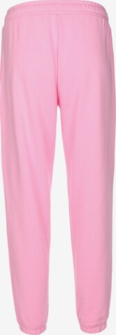 Tapered Pantaloni di new balance in rosa