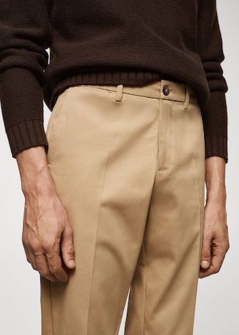 MANGO MAN Normalny krój Spodnie 'Dublino' w kolorze brązowy