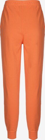 Nike Sportswear Zúžený strih Nohavice - oranžová