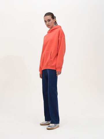 Rockupy Sweatshirt 'Yadriel'‌‌‌‌‌ in Orange