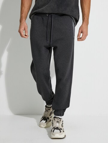 Koton Tapered Trousers in Grey: front