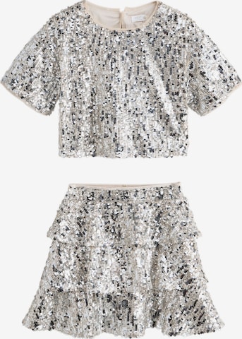 Next Set in Silver: front