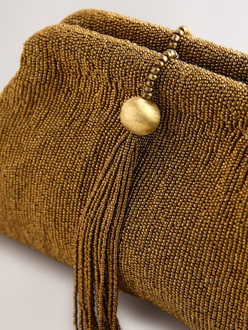 Pochette di Next in oro