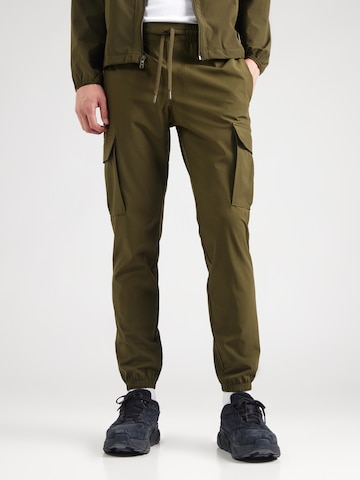 Effilé Pantalon de sport 'Vibe' UNDER ARMOUR en vert : devant