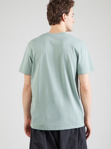 Maglia funzionale di UNDER ARMOUR in verde