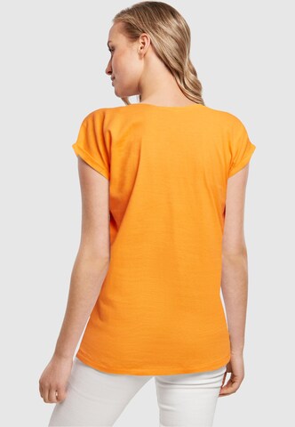 Merchcode T-Shirt 'Summer - Every summer has a story' in Orange