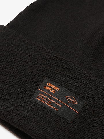 Bonnet 'SURPLUS' Superdry en noir
