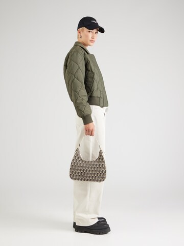 Tommy Jeans Between-Season Jacket 'ONION' in Green