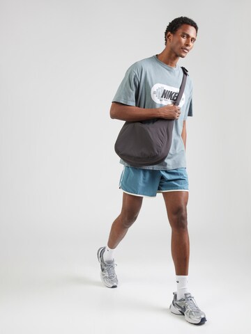 NIKE Functioneel shirt 'M90 GYM HERITAGE' in Grijs
