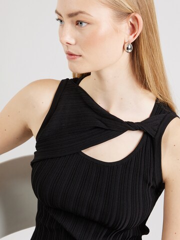 Tops en tricot DKNY en noir