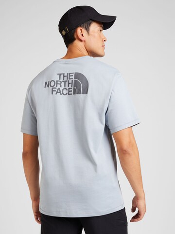 THE NORTH FACE Koszulka w kolorze niebieski: przód
