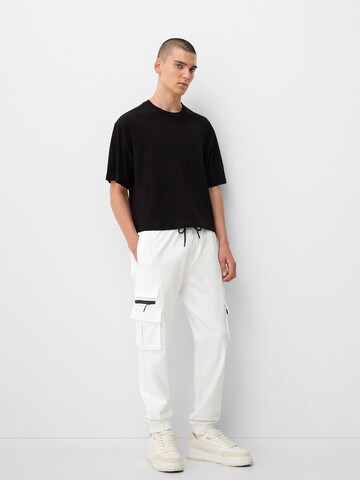 Bershka Tapered Cargo trousers in White