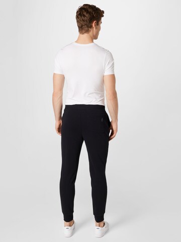 Effilé Pantalon de sport SKECHERS en noir