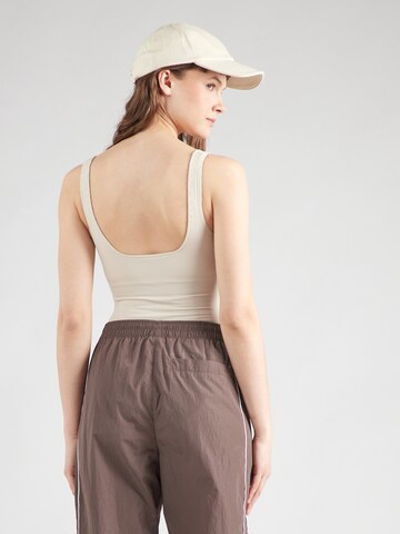Girlfriend Collective Sports bodysuit in Beige